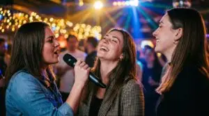 karaoke, singing, friends, party, celebration, nightlife, music, microphone, joy, laughing, girls, evening, fun, entertainment, stage, bar, event, social, happy, lifestyle, ai generated