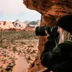 A photographer focuses on capturing the stunning desert landscape in Moapa Valley, Nevada.